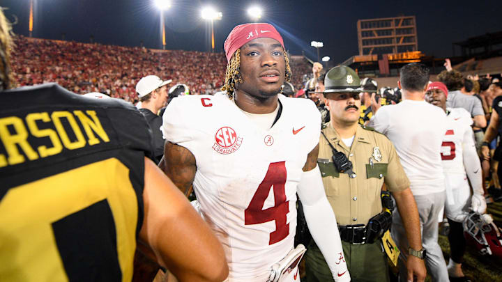 Oct 5, 2024; Nashville, Tennessee, USA;  Alabama Crimson Tide quarterback Jalen Milroe (4) shakes hands with Vanderbilt Commodores wide receiver Micah Bell (26) after a game at FirstBank Stadium. 