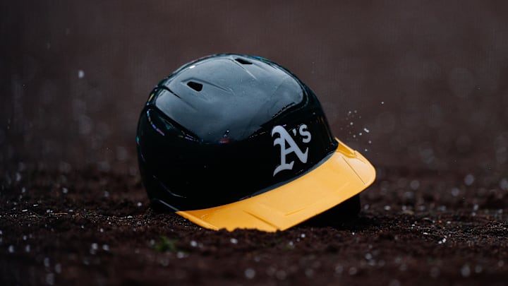 Apr 4, 2025; Denver, Colorado, USA; An Athletics helmet sits in the dirt after being thrown in the tenth inning against the Colorado Rockies at Coors Field. Mandatory Credit: Isaiah J. Downing-Imagn Images Apr 4, 2025; Denver, Colorado, USA; An Athletics helmet sits in the dirt after being thrown in the tenth inning against the Colorado Rockies at Coors Field. Mandatory Credit: Isaiah J. Downing-Imagn Images