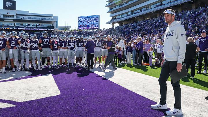 Oct 17, 2026; Manhattan, Kansas, USA; Kansas State Wildcats head coach Collin Klein waits for his team to gather before going to the locker room following a win against the Kansas Jayhawks at Bill Snyder Family Football Stadium. Mandatory Credit: Scott Sewell-Imagn Images Oct 17, 2026; Manhattan, Kansas, USA; Kansas State Wildcats head coach Collin Klein waits for his team to gather before going to the locker room following a win against the Kansas Jayhawks at Bill Snyder Family Football Stadium. Mandatory Credit: Scott Sewell-Imagn Images