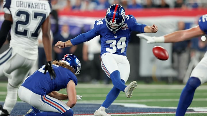 Sep 26, 2024; East Rutherford, New Jersey, USA; New York Giants place kicker Greg Joseph (34) kicks a field goal with punter Jamie Gillan (6) holding during the first quarter against the Dallas Cowboys at MetLife Stadium. 