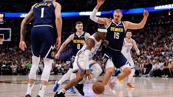 May 11, 2025; Denver, Colorado, USA; Oklahoma City Thunder guard Shai Gilgeous-Alexander (2) controls the ball against Denver Nuggets center Nikola Jokic (15), guard Christian Braun (0) and forward Michael Porter Jr. (1) in the first quarter during Game 4 of the second round at Ball Arena. Mandatory Credit: Isaiah J. Downing-Imagn Images May 11, 2025; Denver, Colorado, USA; Oklahoma City Thunder guard Shai Gilgeous-Alexander (2) controls the ball against Denver Nuggets center Nikola Jokic (15), guard Christian Braun (0) and forward Michael Porter Jr. (1) in the first quarter during Game 4 of the second round at Ball Arena. Mandatory Credit: Isaiah J. Downing-Imagn Images