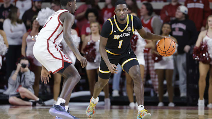 Mar 5, 2025; Norman, Oklahoma, USA; Missouri Tigers guard Marques Warrick (1) dribbles the ball down the court against the Oklahoma Soooners during the first half at Lloyd Noble Center. Mandatory Credit: Alonzo Adams-Imagn Images Mar 5, 2025; Norman, Oklahoma, USA; Missouri Tigers guard Marques Warrick (1) dribbles the ball down the court against the Oklahoma Soooners during the first half at Lloyd Noble Center. Mandatory Credit: Alonzo Adams-Imagn Images