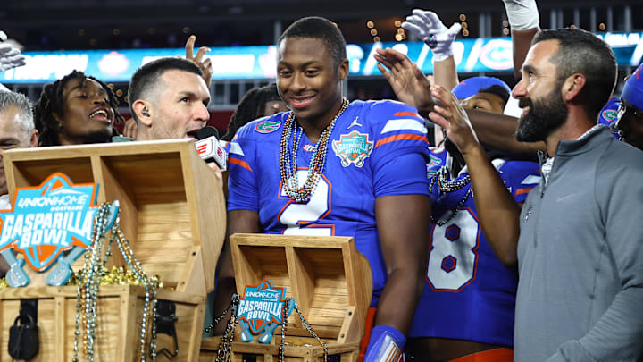 Dec 20, 2024; Tampa, FL, USA; Florida Gators quarterback DJ Lagway (2) is presented the MVP trophy after the win against the Tulane Green Wave at Raymond James Stadium. Mandatory Credit: Kim Klement Neitzel-Imagn Images Dec 20, 2024; Tampa, FL, USA; Florida Gators quarterback DJ Lagway (2) is presented the MVP trophy after the win against the Tulane Green Wave at Raymond James Stadium. Mandatory Credit: Kim Klement Neitzel-Imagn Images