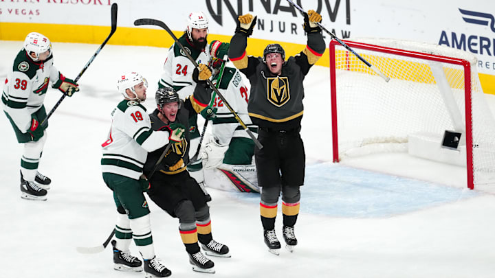 Jan 12, 2025; Las Vegas, Nevada, USA; Vegas Golden Knights left wing Pavel Dorofeyev (16) and Vegas Golden Knights right wing Victor Olofsson (95) celebrate after Vegas Golden Knights center Tomas Hertl (48) scored a goal against the Minnesota Wild during the third period at T-Mobile Arena. Mandatory Credit: Stephen R. Sylvanie-Imagn Images