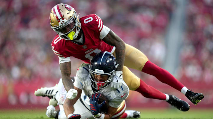 Dec 14, 2025; Santa Clara, California, USA;  San Francisco 49ers cornerback Renardo Green (0) tackles Tennessee Titans wide receiver Chimere Dike (17) during the fourth quarter at Levi's Stadium. Mandatory Credit: Cary Edmondson-Imagn Images