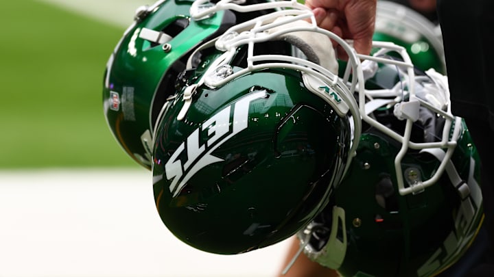 Oct 6, 2024; Tottenham, ENG; New York Jets helmets are held by staff before the match against Minnesota Vikings at Tottenham Hotspur Stadium. Mandatory Credit: Shaun Brooks-Imagn Images Oct 6, 2024; Tottenham, ENG; New York Jets helmets are held by staff before the match against Minnesota Vikings at Tottenham Hotspur Stadium. Mandatory Credit: Shaun Brooks-Imagn Images