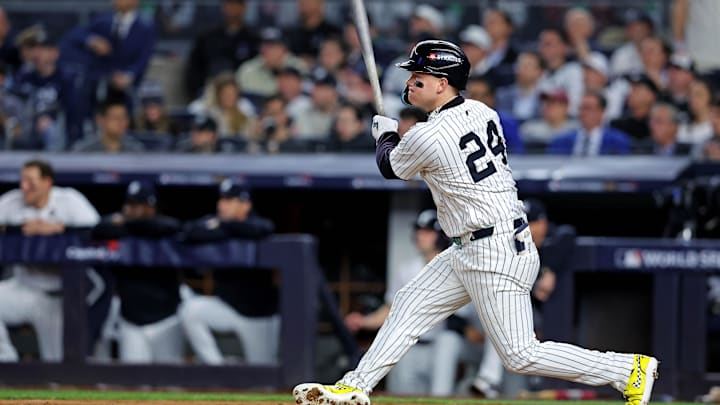 Oct 30, 2024; New York, New York, USA; New York Yankees outfielder Alex Verdugo (24) hits an RBI single during the second inning against the Los Angeles Dodgers in game four of the 2024 MLB World Series at Yankee Stadium. 