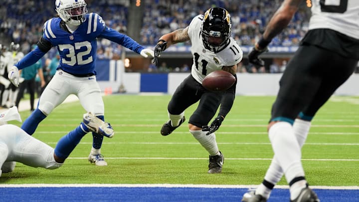 Jacksonville Jaguars wide receiver Parker Washington (11) fumbles the ball before recovering it and scoring a touchdown Sunday, Jan. 5, 2025, during a game against the Indianapolis Colts at Lucas Oil Stadium in Indianapolis.