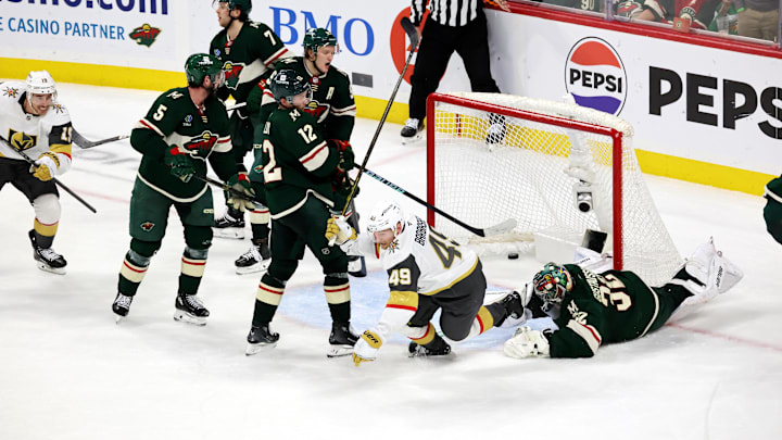 Apr 26, 2025; Saint Paul, Minnesota, USA; Vegas Golden Knights center Ivan Barbashev (49) puts the puck past Minnesota Wild goaltender Filip Gustavsson (32) during 1st OT in game four of the first round of the 2025 Stanley Cup Playoffs at Xcel Energy Center. Vegas Golden Knights win 4-3. Mandatory Credit: Bruce Fedyck-Imagn Images