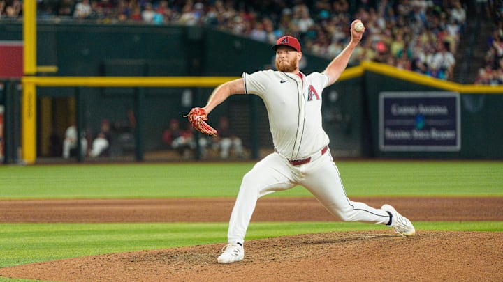 Apr 13, 2025; Phoenix, Arizona, USA; Arizona Diamondbacks pitcher A.J. Puk (33) comes in to close in the ninth inning against the Milwaukee Brewers at Chase Field. Mandatory Credit: Allan Henry-Imagn Images Apr 13, 2025; Phoenix, Arizona, USA; Arizona Diamondbacks pitcher A.J. Puk (33) comes in to close in the ninth inning against the Milwaukee Brewers at Chase Field. Mandatory Credit: Allan Henry-Imagn Images