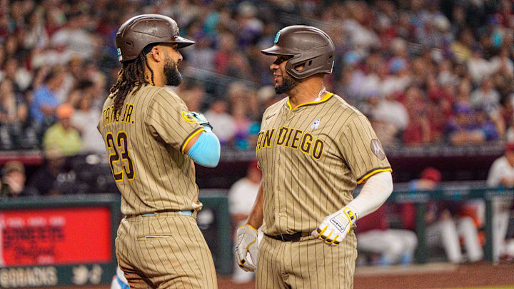 Jun 15, 2025; Phoenix, Arizona, USA; San Diego Padres catcher Elias Diaz (17) celebrates with outfielder Fernando Tatis Jr. (23) after hitting a home run in the ninth inning against the Arizona Diamondbacks at Chase Field. Mandatory Credit: Allan Henry-Imagn Images