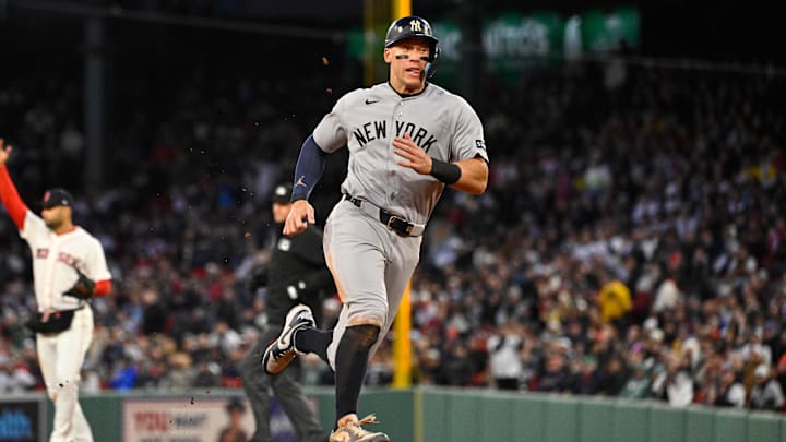 Apr 22, 2026; Boston, Massachusetts, USA; New York Yankees right fielder Aaron Judge (99) runs to third base against the Boston Red Sox during third inning at Fenway Park. Mandatory Credit: Eric Canha-Imagn Images