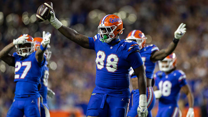 Nov 16, 2024; Gainesville, Florida, USA; Florida Gators defensive lineman Caleb Banks (88) celebrates with the ball after a fumble recovery against the LSU Tigers during the second half at Ben Hill Griffin Stadium.