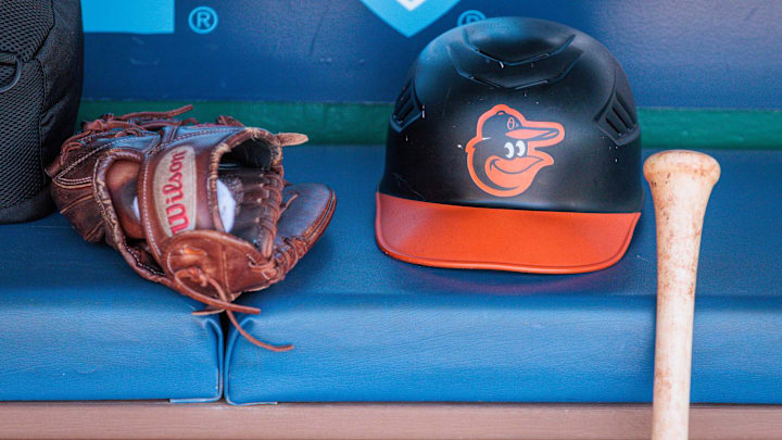 Apr 21, 2024; Kansas City, Missouri, USA; Baltimore Orioles hat and glove sits in the dugout during the ninth inning against the Kansas City Royals at Kauffman Stadium. Apr 21, 2024; Kansas City, Missouri, USA; Baltimore Orioles hat and glove sits in the dugout during the ninth inning against the Kansas City Royals at Kauffman Stadium.