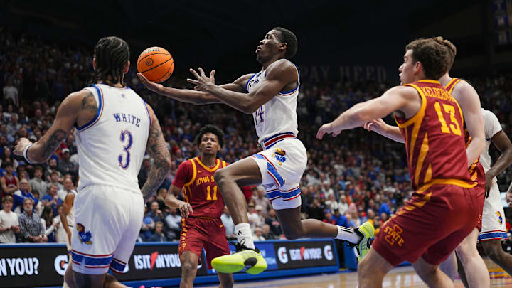 Jan 13, 2026; Lawrence, Kansas, USA; Kansas Jayhawks guard Melvin Council Jr. (14) shoots during the second half against the Iowa State Cyclones at Allen Fieldhouse. Mandatory Credit: Jay Biggerstaff-Imagn Images