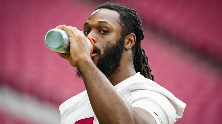 Cardinals edge rusher Baron Browning (5) gets a drink during training camp at State Farm Stadium in Glendale on July 30, 2026. Cardinals edge rusher Baron Browning (5) gets a drink during training camp at State Farm Stadium in Glendale on July 30, 2026.