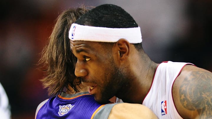 LeBron James hugs his new podcast co-host more than a decade ago.