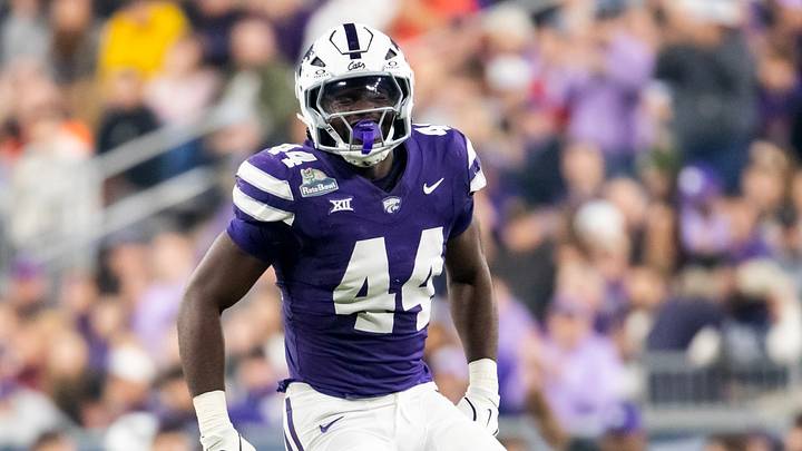 Dec 26, 2024; Phoenix, AZ, USA; Kansas State Wildcats defensive end Tobi Osunsanmi (44) against the Rutgers Scarlet Knights during the Rate Bowl at Chase Field. Mandatory Credit: Mark J. Rebilas-Imagn Images