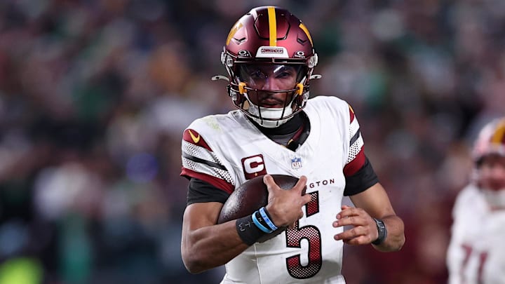 Jan 26, 2025; Philadelphia, PA, USA; Washington Commanders quarterback Jayden Daniels (5) runs with the ball against the Philadelphia Eagles during the second half in the NFC Championship game at Lincoln Financial Field. Mandatory Credit: Bill Streicher-Imagn Images