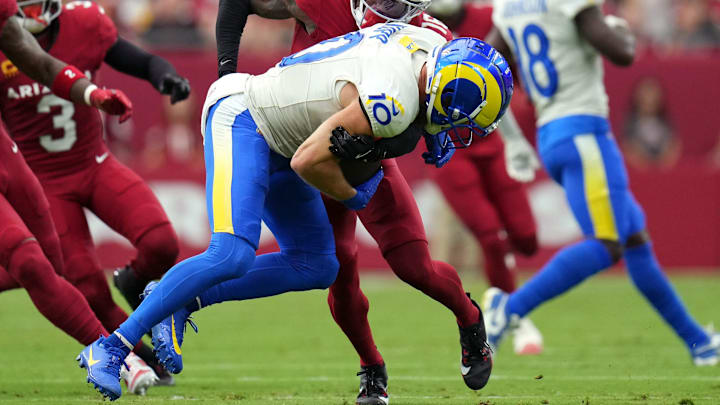 Los Angeles Rams receiver Cooper Kupp is tackled with the ball.