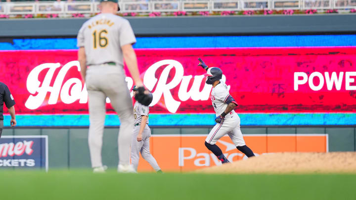 Jun 13, 2024; Minneapolis, Minnesota, USA; Minnesota Twins shortstop Carlos Correa (4) celebrates his home run against the Oakland Athletics pitcher Sean Newcomb (16) in the seventh inning at Target Field. 