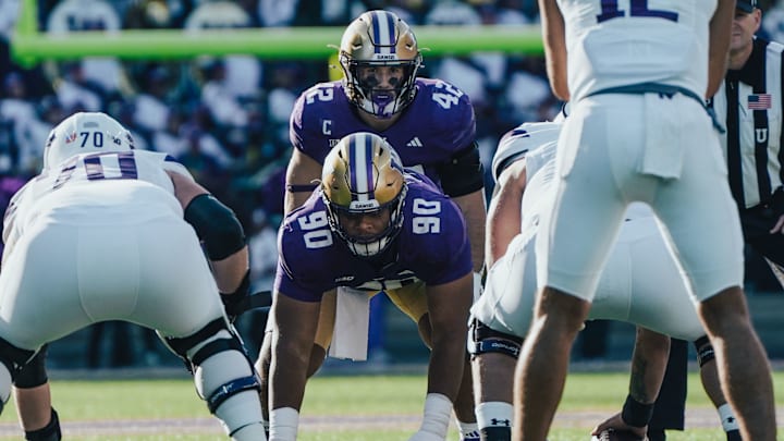 UW linebacker Carson Bruener lines up behind Elinneus Davis against Northwestern. UW linebacker Carson Bruener lines up behind Elinneus Davis against Northwestern.