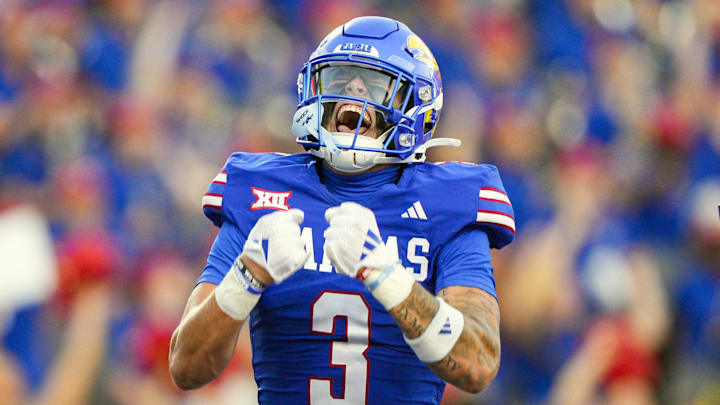 Aug 23, 2025; Lawrence, Kansas, USA; Kansas Jayhawks wide receiver Keaton Kubecka (3) celebrates after scoring a touchdown during the second half against the Fresno State Bulldogs at David Booth Kansas Memorial Stadium. Mandatory Credit: Jay Biggerstaff-Imagn Images