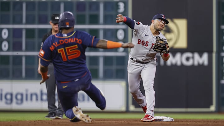 Houston Astros catcher Martin Maldonado (15) is out at second base as Boston Red Sox second baseman Yolmer Sanchez (47) throws to first base to complete a double play during the seventh inning at Minute Maid Park on Aug. 1, 2022. Houston Astros catcher Martin Maldonado (15) is out at second base as Boston Red Sox second baseman Yolmer Sanchez (47) throws to first base to complete a double play during the seventh inning at Minute Maid Park on Aug. 1, 2022.