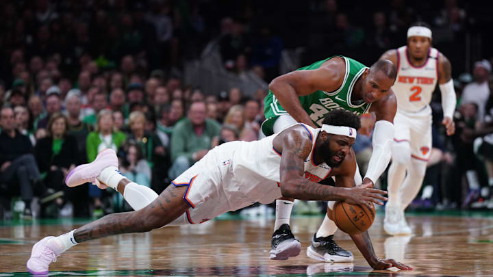 May 7, 2025; Boston, Massachusetts, USA; New York Knicks center Mitchell Robinson (23) works for the ball against Boston Celtics center Al Horford (42) in the second quarter during game two of the second round for the 2025 NBA Playoffs at TD Garden. Mandatory Credit: David Butler II-Imagn Images