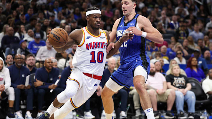 Feb 27, 2025; Orlando, Florida, USA; Golden State Warriors forward Jimmy Butler III (10) is guarded by Orlando Magic forward Franz Wagner (22) in the fourth quarter at Kia Center. Mandatory Credit: Nathan Ray Seebeck-Imagn Images