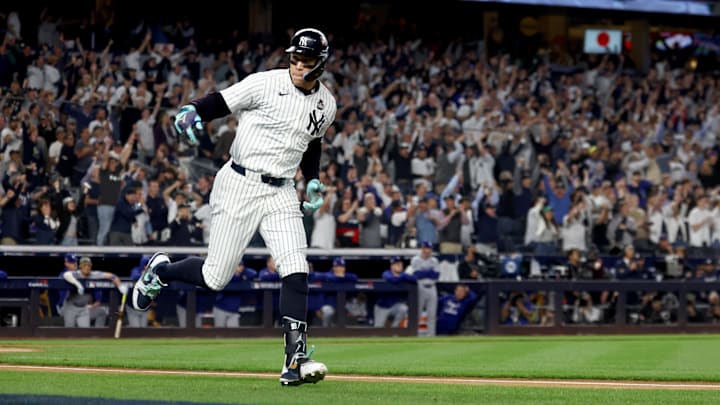 Oct 30, 2024; New York, New York, USA; New York Yankees outfielder Aaron Judge (99) reacts after hitting a two-run home run during the first inning against the Los Angeles Dodgers in game five of the 2024 MLB World Series at Yankee Stadium. Mandatory Credit: Vincent Carchietta-Imagn Images
