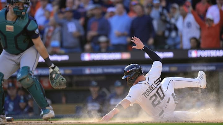 Tigers first baseman Spencer Torkelson slides into home to score a run against Mariners during sixth inning of Game 4 of ALDS at Comerica Park in Detroit on Wednesday, Oct. 8, 2025.