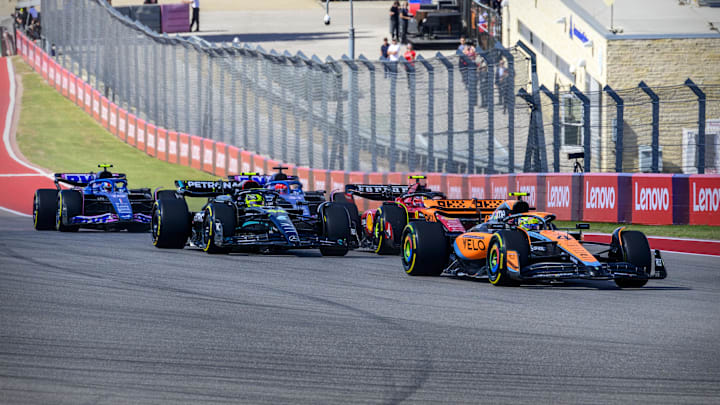 Oct 22, 2023; Austin, Texas, USA; McLaren F1 driver Lando Norris (4) of Team Great Britain and Mercedes AMG Petronas Motorsport driver Lewis Hamilton (44) of Team Great Britain and Scuderia Ferrari driver Carlos Sainz (55) of Team Spain drives during the 2023 United States Grand Prix at Circuit of the Americas. Mandatory Credit: Jerome Miron-USA TODAY Sports