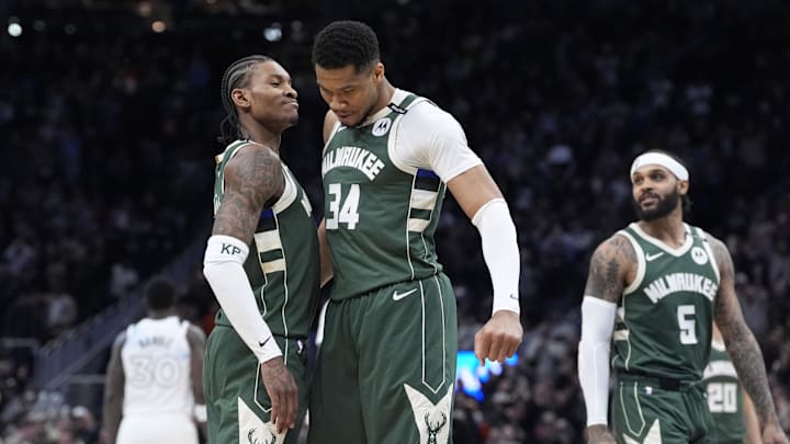 Milwaukee Bucks guard Kevin Porter Jr. and Milwaukee Bucks forward Giannis Antetokounmpo celebrate as the clock winds down in their 110-103 comeback victory over the Minnesota Timberwolves at Fiserv Forum on April 8.