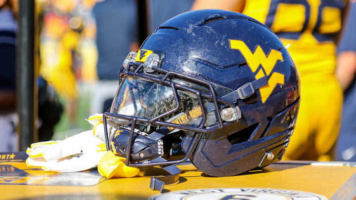 Aug 30, 2025; Morgantown, West Virginia, USA; A West Virginia Mountaineers football helmet is seen along the sidelines during the fourth quarter against the Robert Morris Colonials at Milan Puskar Stadium. Mandatory Credit: Ben Queen-Imagn Images