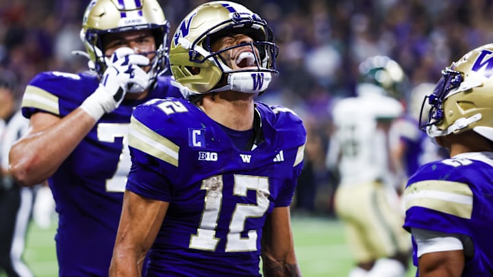Washington Huskies wide receiver Denzel Boston celebrates after catching a touchdown pass against the Colorado State Rams.