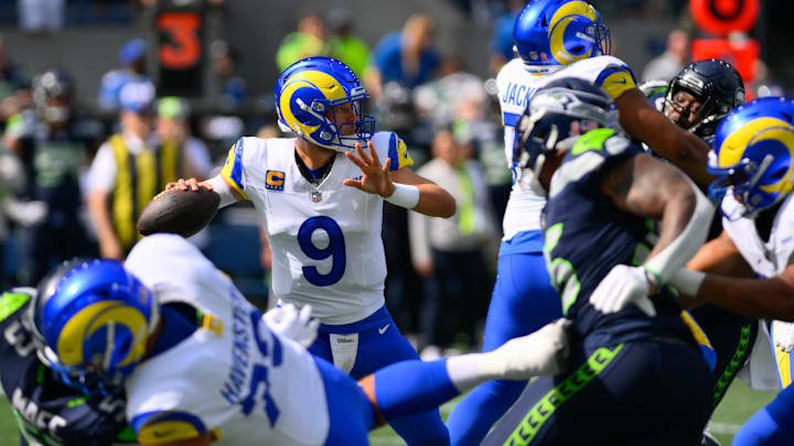 Sep 10, 2023; Seattle, Washington, USA; Los Angeles Rams quarterback Matthew Stafford (9) passes the ball against the Seattle Seahawks during the first half at Lumen Field. Mandatory Credit: Steven Bisig-Imagn Images