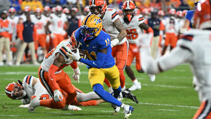 Oct 24, 2024; Pittsburgh, Pennsylvania, USA; Pittsburgh Panthers wide receiver Censere Lee (11) eludes Syracuse Orange defenders on a touchdown during the second quarter at Acrisure Stadium. Mandatory Credit: Barry Reeger-Imagn Images Oct 24, 2024; Pittsburgh, Pennsylvania, USA; Pittsburgh Panthers wide receiver Censere Lee (11) eludes Syracuse Orange defenders on a touchdown during the second quarter at Acrisure Stadium. Mandatory Credit: Barry Reeger-Imagn Images