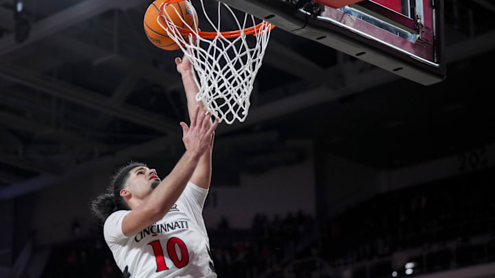 Nov 3, 2025; Cincinnati, Ohio, USA;  Cincinnati Bearcats guard Shon Abaev (10) drives to the basket against the Western Carolina Catamounts in the second half at Fifth Third Arena. Mandatory Credit: Aaron Doster-Imagn Images