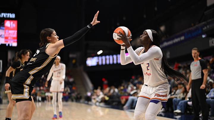 Sep 4, 2025; Washington, District of Columbia, USA;  Phoenix Mercury guard Kahleah Copper (2) attempts a shot in front of Washington Mystics guard Jade Melbourne (5) during the first quarter at CareFirst Arena. Mandatory Credit: Rafael Suanes-Imagn Images