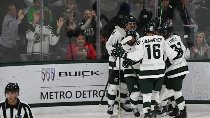 Members of the MSU hockey teams celebrate a goal against Boston College, Saturday, Oct. 12, 2024, at Munn Ice Arena in East Lansing. MSU won 4-3.