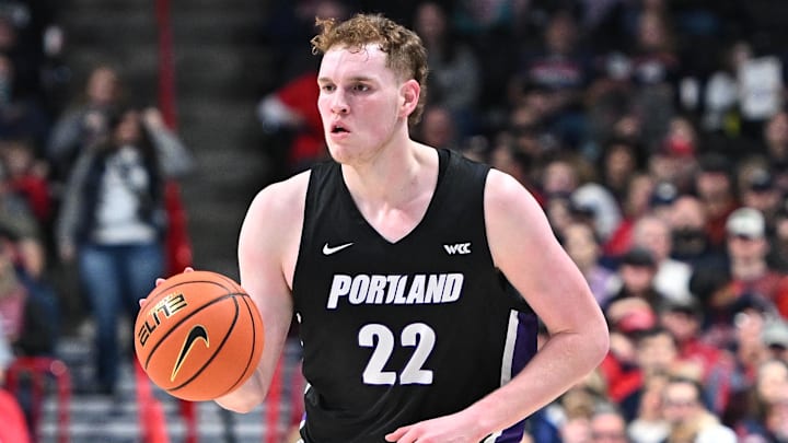 Jan 2, 2025; Spokane, Washington, USA; Portland Pilots forward Austin Rapp (22) controls the ball against the Gonzaga Bulldogs in the first half at McCarthey Athletic Center. Mandatory Credit: James Snook-Imagn Images