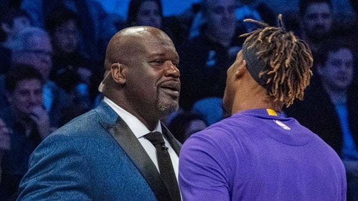 February 15, 2020; Chicago, Illinois, USA; NBA great Shaquille O'Neal (left) shakes hands with Los Angeles Lakers player Dwight Howard (right) during NBA All Star Saturday Night at United Center. Mandatory Credit: Kyle Terada-Imagn Images