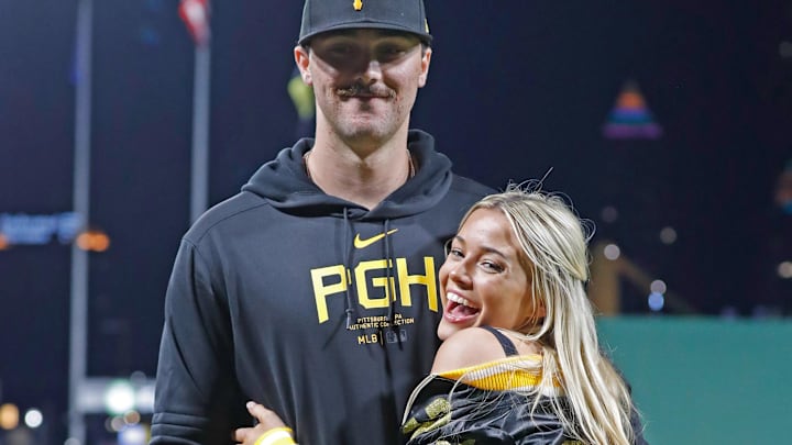 Pittsburgh Pirates starting pitcher Paul Skenes (30) poses with his girlfriend Louisiana State University gymnast Livvy Dunne after Skenes made his major league debut against the Chicago Cubs at PNC Park. 