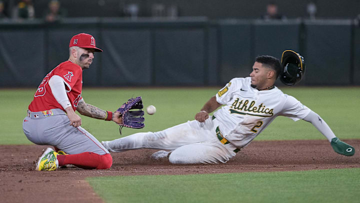 Aug 15, 2025; West Sacramento, California, USA; Los Angeles Angels shortstop Zach Neto (9) attempts to tag out Athletics third baseman Darell Hernaiz (2) during the third inning at Sutter Health Park. Mandatory Credit: Ed Szczepanski-Imagn Images Aug 15, 2025; West Sacramento, California, USA; Los Angeles Angels shortstop Zach Neto (9) attempts to tag out Athletics third baseman Darell Hernaiz (2) during the third inning at Sutter Health Park. Mandatory Credit: Ed Szczepanski-Imagn Images
