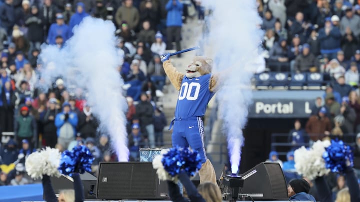 Nov 19, 2022; Provo, Utah, USA; Cosmo the Brigham Young Cougars mascot encourages the fans against the Utah Tech Trailblazers between the third and fourth quarters at LaVell Edwards Stadium. Mandatory Credit: Rob Gray-USA TODAY Sports