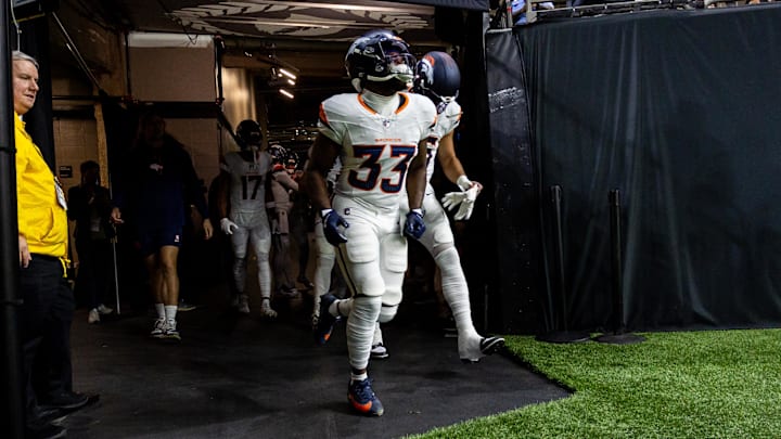Denver Broncos running back Javonte Williams runs out the tunnel before the game against the New Orleans Saints.