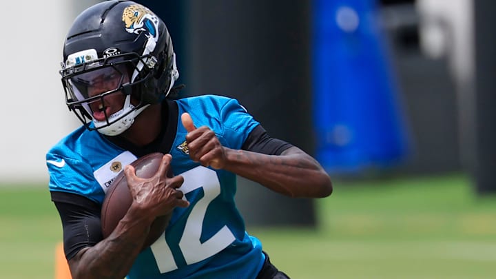 Jacksonville Jaguars wide receiver Travis Hunter (12) runs the ball during a rookie minicamp at Miller Electric Center Saturday, May 10, 2025 in Jacksonville, Fla. [Corey Perrine/Florida Times-Union]