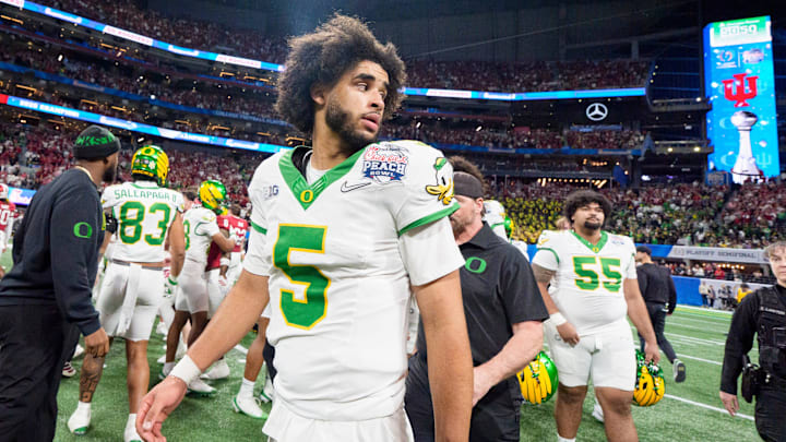 Oregon quarterback Dante Moore walks the field after the Ducks’ loss as the Oregon Ducks face the Indiana Hoosiers in the Peach Bowl on Jan. 9, 2026, at Mercedes-Benz Stadium in Atlanta, Georgia.