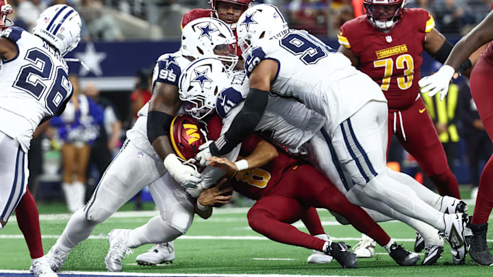 Dallas Cowboys NT Kenny Clark, EDGE Donovan Ezeiruaku and DT Solomon Thomas sack Washington Commanders QB Marcus Mariota. Dallas Cowboys NT Kenny Clark, EDGE Donovan Ezeiruaku and DT Solomon Thomas sack Washington Commanders QB Marcus Mariota.